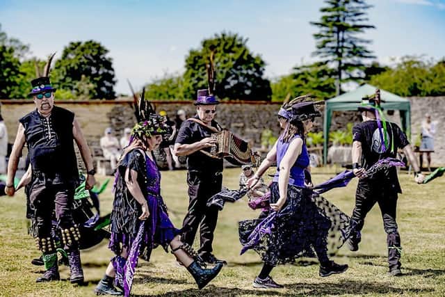 With the music playing and the bells on their legs jangling, the Hemlock Morris Dancers go through their paces
