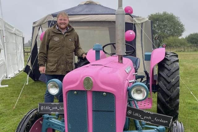 Kaleb Cooper popped by to see the pink tractor/photo Anna Griffiths