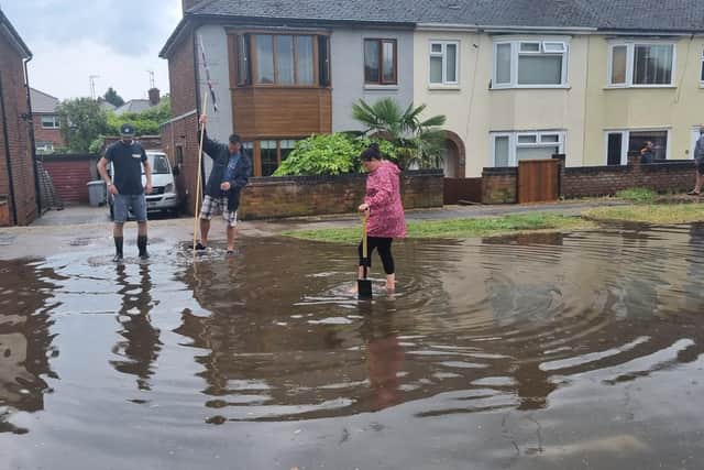 Residents in Springfield Road Kettering during a flash flood in June 2023