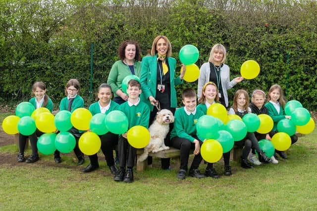 Angela Holyhead Josie Garnham and Mia Lewis with the school council and Jeff the reading dog