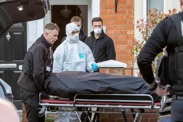 Forensic officers remove Nicholas Billingham's body from Fiona Beal's house in Moore Street, Kingsley on March 20, 2022.