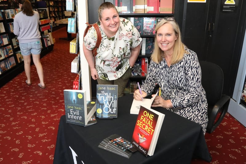 Kettering Festival of Literature 2023 - Loddington author Jane Isaac signs one of her novels for Rachel Hull.
