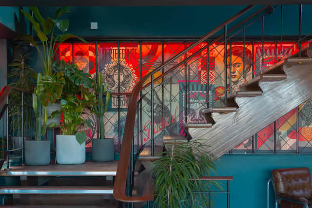 Artwork on the feature wall uses signed Shepard Fairey lithograph prints / Louis for Lucky Chuck's