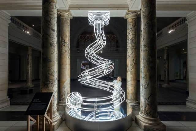 Artist Anna Lomax with 'All Lit Up' the V&A's centrepiece Christmas 'tree' created using steel tubing manufactured in Kettering by Cooney Marine International/V&A