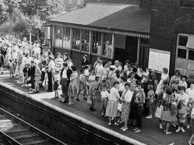 Busy day at Corby station. Families gather in the sunshine to wait for their train