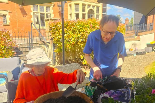 Residents enjoy the sun and get planting at Elm Bank Care Home in Kettering