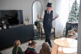 Mark Fraser performing for the pupils of Priors Hall ALC in a David Wilson Homes show home.