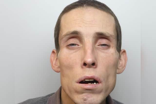 A previous custody image of Robert Mort.