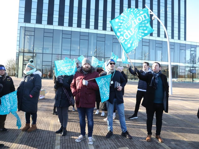 NEU members with flags outside the Corby Cube