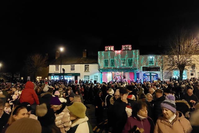 Earls Barton celebrates Christmas Eve in the Square - Attendees wrapped up warm to brave the elements