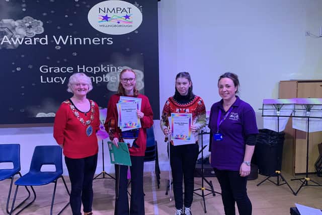 Lucy Campbell and Grace Hopkins receive the Gordon Robinson Award from mayor Valerie Anslow