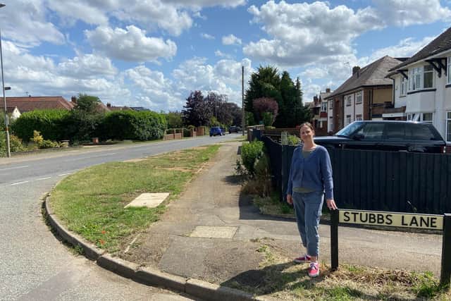 Lauren standing near the point where the pavement in Warkton Lane ends.