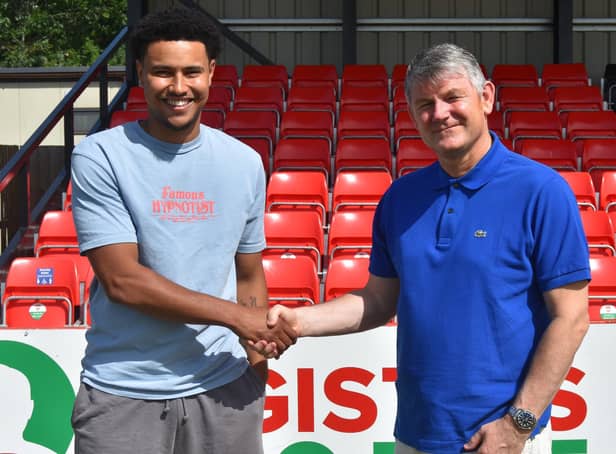 Jordan Graham shakes on it with boss Lee Glover after agreeing a deal at Kettering Town. Picture courtesy of Poppies Media