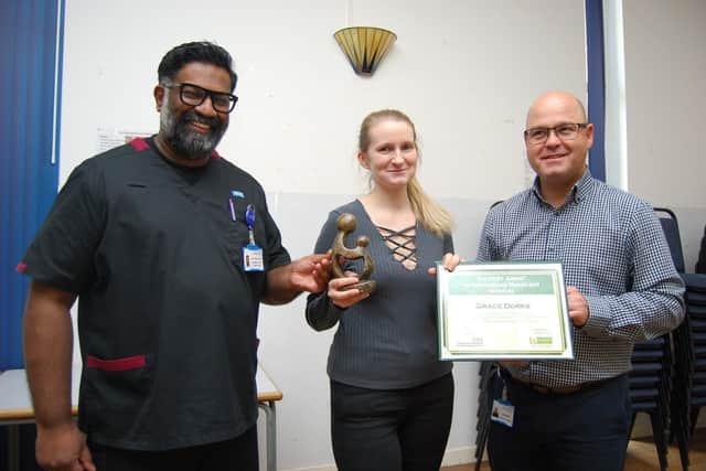 Midwife Grace Dorks presented with her award by Director of Allied Health Professionals Prof Ganesh Baliah and Director of Nursing Robin Binks