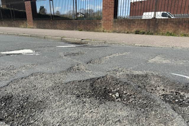 A potholed speedbump outside Lodge Park in Shetland Way, Corby. Image: National World
