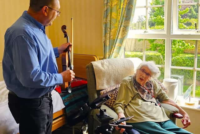 103 year old resident Doris enjoying her unique room concert.
