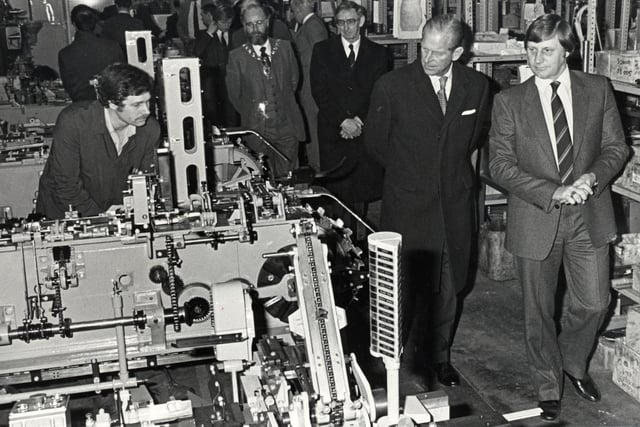 The Duke of Edinburgh is shown around the Pakcraft factory in Corby by managing director Neville Parlour during a visit in 1982