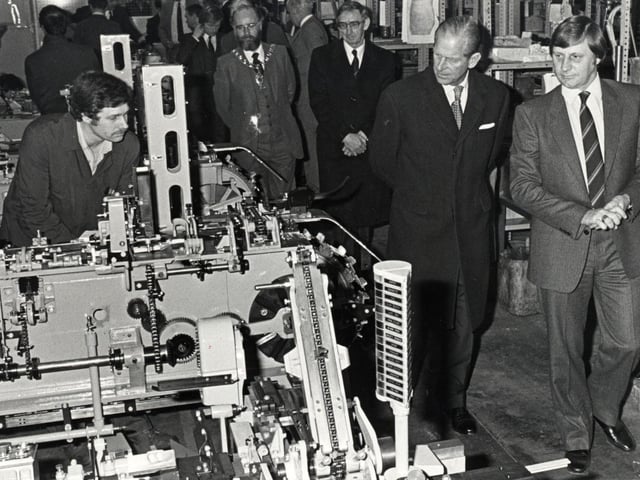 The Duke of Edinburgh is shown around the Pakcraft factory in Corby by managing director Neville Parlour during a visit in 1982