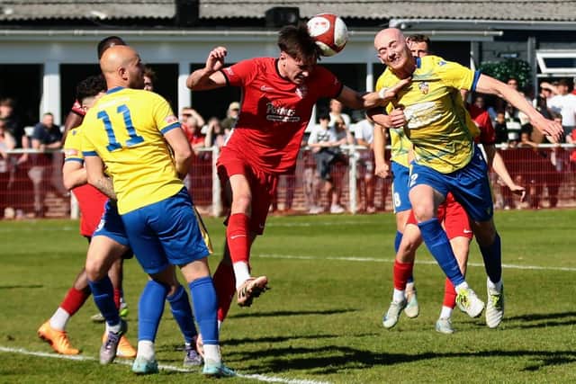 Charlie Green battles for the ball during Wellingborough Town's 1-0 defeat at Anstey Nomads on Saturday (Picture: Rob Webb)