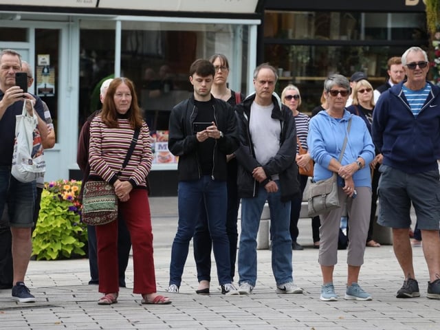People stood in respectful silence