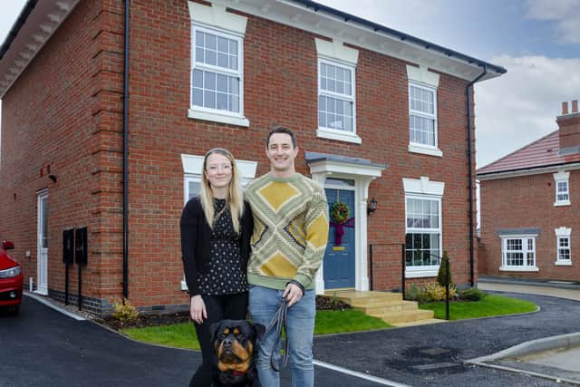 Kayleigh Chambers and Alex Newman with Bear the dog. Image: Urban & Civic.