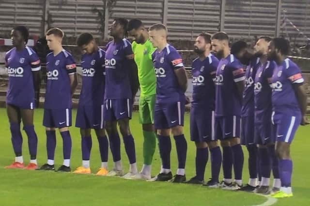 The Corby Town players paid their respects to Her Majesty Queen Elizabeth II ahead of their FA Trophy defeat at Loughborough Dynamo. Picture by David Tilley