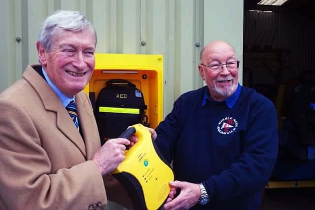 Defibrillator presentation with Richard Allen from RALPHH (left) and Middle Nene Sailing Club commodore Tony Wright (credit Middle Nene SC)