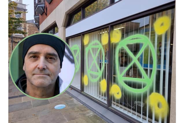 Dr Alan Heath (inset) with the daubed Barclays Bank