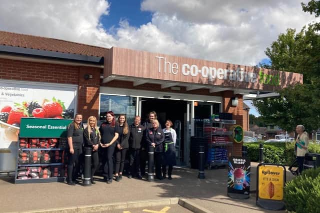 Store Manager Rebecca Wilkinson and her team outside the new look Central England Co-op in Hallwood Road, Kettering