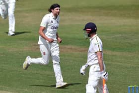 Jack White celebrates claiming the wicket of Warwickshire opener Dom Sibley