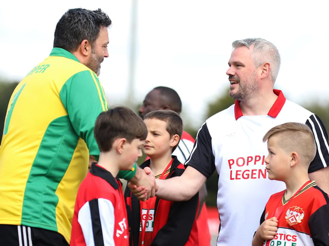Players from a different era met as Lee Harper shakes hands with Wayne Diuk