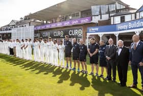 Northants and Surrey players and officials pay their respects to the late Queen Elizabeth II during a minute's silence ahead of play in the LV= Insurance County Championship Division One match at the County Ground (Picture: Andy Kearns/Getty Images)
