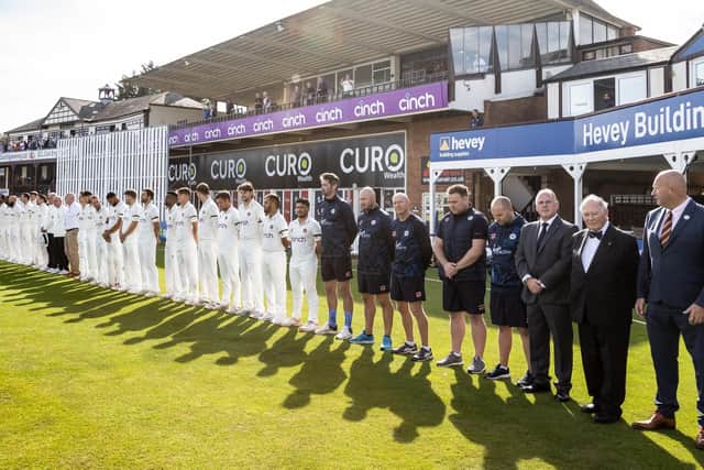 Northants and Surrey players and officials pay their respects to the late Queen Elizabeth II during a minute's silence ahead of play in the LV= Insurance County Championship Division One match at the County Ground (Picture: Andy Kearns/Getty Images)