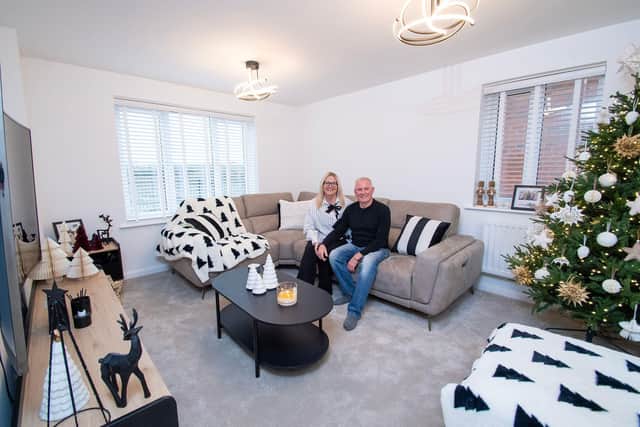 Paul and Natalie Curtis in their living room, decorated for the festive season.