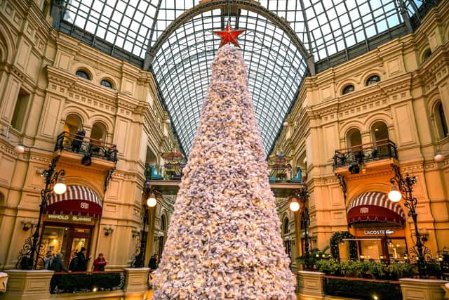 A Christmas tree is seen with a decoration alike the Kremlin Star, at the GUM department store in the Red Square in Moscow on November 16, 2022. (Photo by Yuri KADOBNOV / AFP) (Photo by YURI KADOBNOV/AFP via Getty Images)