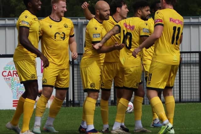 James Clifton is congratulated after firing AFC Rushden & Diamonds into a 1-0 lead at Corby (Picture: Shaun Frankham)