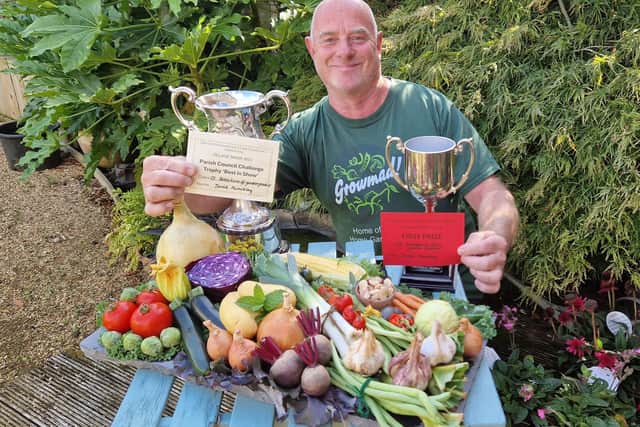 David with his trophies and award-winning vegetables