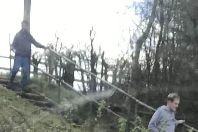 Police would like to speak to the two men in the image.