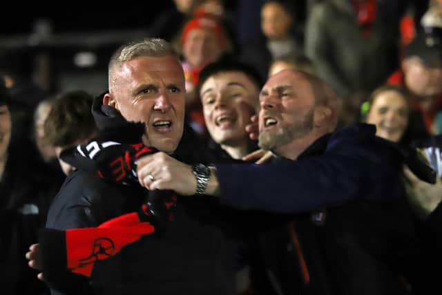 Poppies boss Richard Lavery celebrates with the fans after the win (Picture: Peter Short)