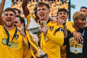 Ben Williams lifts the Southern League Premier Central trophy at the end of last season (Picture: RB Media)