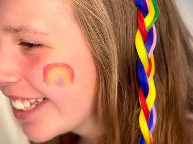 Here's Scarlet, who's got her best rainbow hair extensions in today