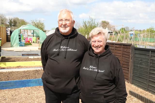 l-r Bud and Sue Abbott cleared shoulder-high weeds from the plot