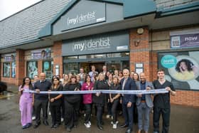 Sarah Webster, Practice Manager at mydentist Kettering cuts the ribbon with colleagues/mydentist Kettering