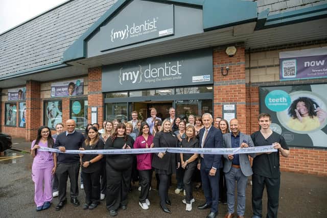 Sarah Webster, Practice Manager at mydentist Kettering cuts the ribbon with colleagues/mydentist Kettering