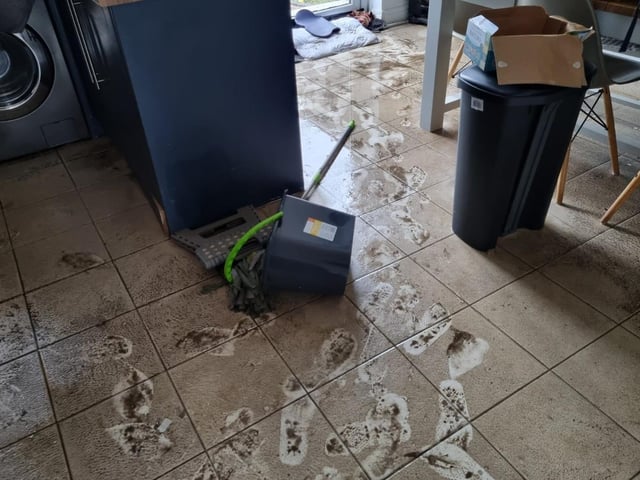Filthy flood water seeped under the front door