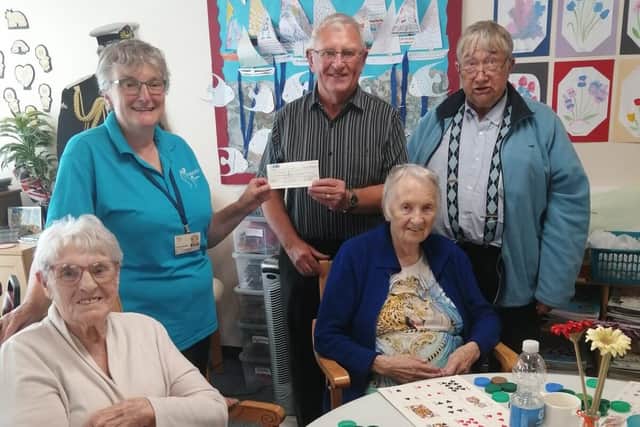 Worshipful Brother and Master of Risdene Lodge Steve Squires(centre) with cheque for Cando