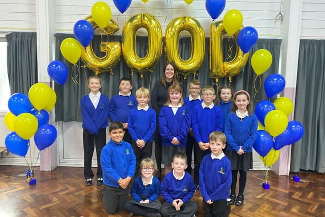 Principal Mrs Samantha Eathorne celebrates with pupils from Beanfield Primary School, Corby after their latest 'Good' Ofsted report