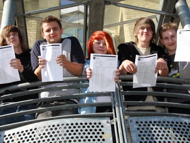 Liam Boyle, Sam Rice, Rachel Fonseca, Jake Matthews and Chris Smith hold up their GCSE exam results, 2010