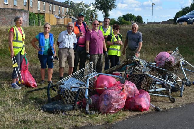 Members of Wellie Wombles clearing up on the Queensway