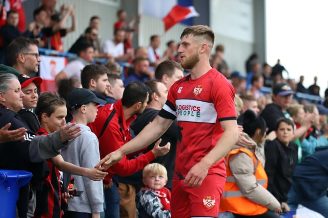 Captain Connor Kennedy shares a moment with the supporters after the Poppies fell just short in their play-off bid